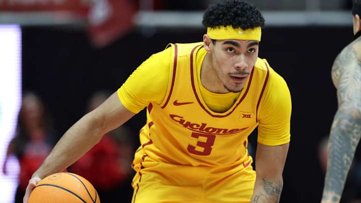 Feb 24, 2026; Salt Lake City, Utah, USA; Iowa State Cyclones guard Tamin Lipsey (3) dribbles the ball as Utah Utes guard Terrence Brown (2) defends during the first half at Jon M. Huntsman Center.