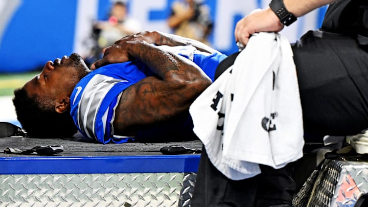 Detroit Lions cornerback D.J. Reed (4) is carted off the field after an injury during the second half against the Cleveland Browns at Ford Field.
