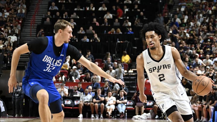 Jul 12, 2025; Las Vegas, NV, USA; Dallas Mavericks forward Cooper Flagg (32) defends against San Antonio Spurs guard Dylan Harper (2) in the second quarter of their game at Thomas & Mack Center. Mandatory Credit: Candice Ward-Imagn Images Jul 12, 2025; Las Vegas, NV, USA; Dallas Mavericks forward Cooper Flagg (32) defends against San Antonio Spurs guard Dylan Harper (2) in the second quarter of their game at Thomas & Mack Center. Mandatory Credit: Candice Ward-Imagn Images