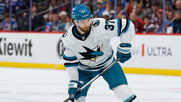 Feb 4, 2026; Denver, Colorado, USA; San Jose Sharks defenseman Timothy Liljegren (37) attempts a shot as Colorado Avalanche left wing Artturi Lehkonen (62) defends in the first period at Ball Arena. Mandatory Credit: Isaiah J. Downing-Imagn Images