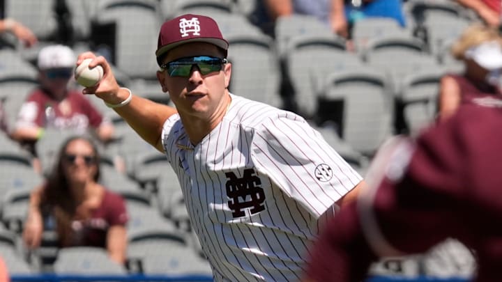 Mississippi State third baseman Ace Reese (3) fields a bunt by Texas A&M second baseman Ben Royo (10) but makes a wild throw to first in the first round of the SEC Baseball Tournament at the Hoover Met.
