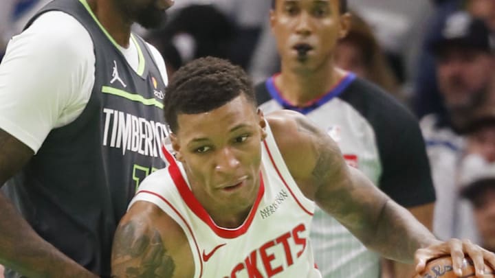 Nov 26, 2024; Minneapolis, Minnesota, USA; Houston Rockets forward Jabari Smith (10) drives around Minnesota Timberwolves center Naz Reid (11) in the third quarter at Target Center. Mandatory Credit: Bruce Kluckhohn-Imagn Images