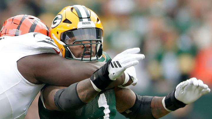Green Bay Packers defensive end Micah Parsons is grabbed by a Benals defender. Green Bay Packers defensive end Micah Parsons is grabbed by a Benals defender.