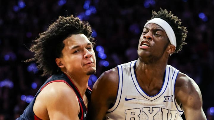Feb 18, 2026; Tucson, Arizona, USA; Brigham Young Cougars forward AJ Dybantsa (3) dribbles the ball while Arizona Wildcats guard Brayden Burries (5) attempts to block him during the first half of the game at McKale Memorial Center. Mandatory Credit: Aryanna Frank-Imagn Images