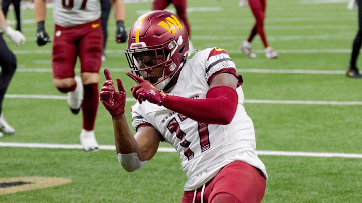 Dec 15, 2024; New Orleans, Louisiana, USA;  Washington Commanders wide receiver Terry McLaurin (17) celebrates a touchdown against the New Orleans Saints cornerback Kool-Aid McKinstry (14) during the first half at Caesars Superdome. Mandatory Credit: Matthew Hinton-Imagn Images
