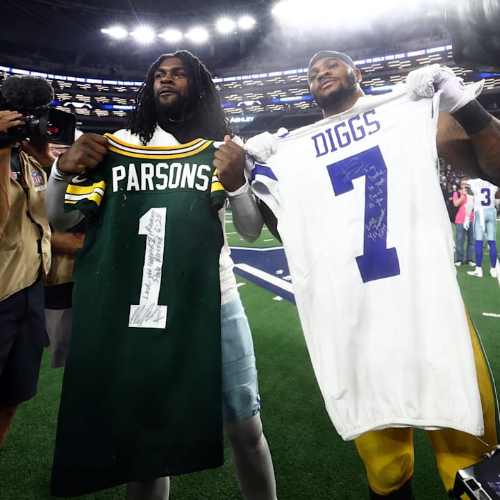 Green Bay Packers defensive end Micah Parsons and Dallas Cowboys cornerback Trevon Diggs exchange jerseys