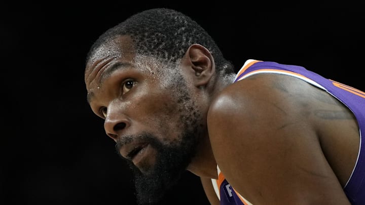 Mar 17, 2025; Phoenix, Arizona, USA; Phoenix Suns forward Kevin Durant (35) during a timeout in the second half against the Toronto Raptors at Footprint Center. Mandatory Credit: Rick Scuteri-Imagn Images