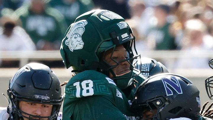 Michigan State linebacker Dion Crawford (18) tackles a Northwestern player at Spartan Stadium on Saturday, Oct. 17, 2026 Michigan State linebacker Dion Crawford (18) tackles a Northwestern player at Spartan Stadium on Saturday, Oct. 17, 2026