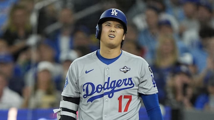 Oct 25, 2025; Toronto, Ontario, CAN; Los Angeles Dodgers two-way player Shohei Ohtani (17) reacts after fouling a ball off of his foot in the eighth inning during game two of the 2025 MLB World Series at Rogers Centre. Mandatory Credit: John E. Sokolowski-Imagn Images