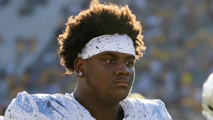 Nov 18, 2023; Tempe, Arizona, USA; Oregon Ducks defensive lineman A'Mauri Washington (58) against the Arizona State Sun Devils at Mountain America Stadium. Mandatory Credit: Mark J. Rebilas-Imagn Images Nov 18, 2023; Tempe, Arizona, USA; Oregon Ducks defensive lineman A'Mauri Washington (58) against the Arizona State Sun Devils at Mountain America Stadium. Mandatory Credit: Mark J. Rebilas-Imagn Images