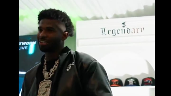 Shedeur Sanders speaks to his draft party after not being selected in the first round of the 2025 NFL draft.