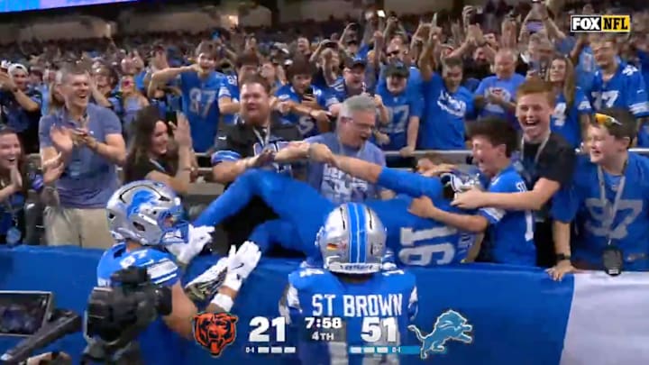 Goff leaped into the stands following a four-yard TD pass to wideout Amon-Ra St. Brown.