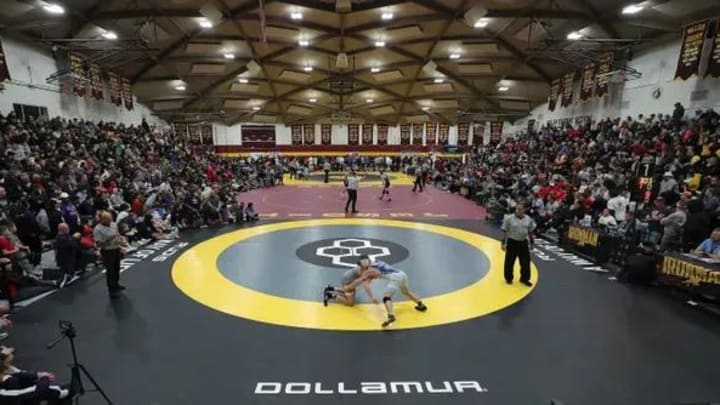 Wrestlers and fans pack into The Dome to watch the final round of the Ironman wrestling tournament at Walsh Jesuit High School. Wrestlers and fans pack into The Dome to watch the final round of the Ironman wrestling tournament at Walsh Jesuit High School.