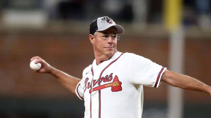 Oct 31, 2021; Atlanta, Georgia, USA; Atlanta Braves hall of fame pitcher Greg Maddux throws out the ceremonial first pitch prior to game five of the 2021 World Series against the Houston Astros at Truist Park. Mandatory Credit: Brett Davis-Imagn Images