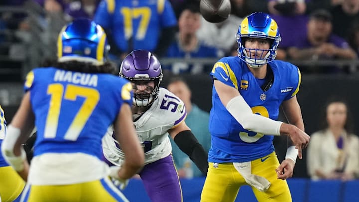 Los Angeles Rams quarterback Matthew Stafford (9) throws the ball to receiver Puka Nacua (17) against the Minnesota Vikings during their playoff game at State Farm Stadium on Jan. 13, 2025, in Glendale.