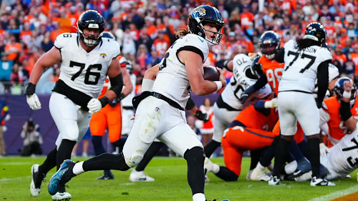 Dec 21, 2025; Denver, Colorado, USA; Jacksonville Jaguars quarterback Trevor Lawrence (16) rushes for a touchdown against the Denver Broncos during the second half at Empower Field at Mile High. Mandatory Credit: Ron Chenoy-Imagn Images Dec 21, 2025; Denver, Colorado, USA; Jacksonville Jaguars quarterback Trevor Lawrence (16) rushes for a touchdown against the Denver Broncos during the second half at Empower Field at Mile High. Mandatory Credit: Ron Chenoy-Imagn Images