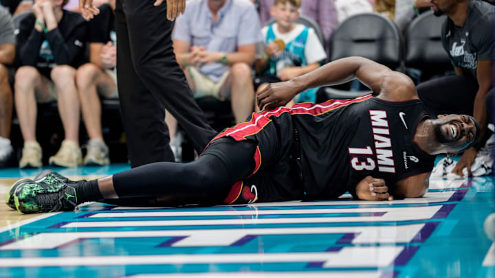 Heat star Bam Adebayo left the play-in game vs. the Hornets early after being tripped by LaMelo Ball.