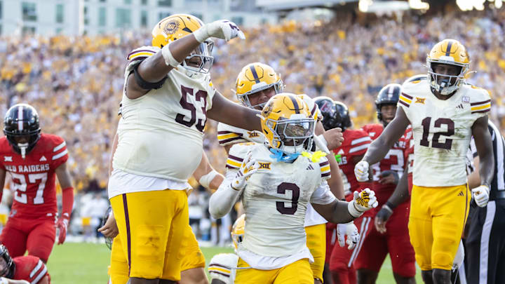Oct 18, 2025; Tempe, Arizona, USA; Arizona State Sun Devils running back Raleek Brown (3) celebrates with offensive lineman Josh Atkins (53) and wide receiver Malik McClain (12) after scoring a touchdown against the Texas Tech Red Raiders in the fourth quarter at Mountain America Stadium. Mandatory Credit: Mark J. Rebilas-Imagn Images