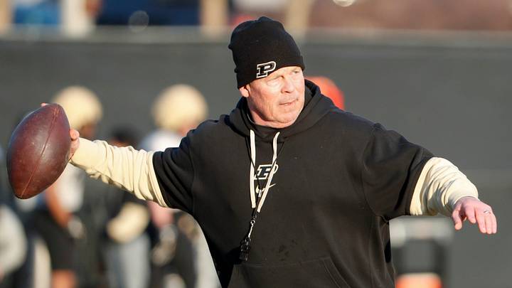 Purdue Boilermakers special teams coordinator James Shibest throws the ball.