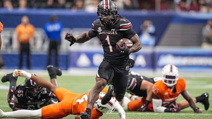 Aug 31, 2025; Atlanta, Georgia, USA; South Carolina Gamecocks running back Rahsul Faison (1) runs for a big gain against the Virginia Tech Hokies during the first half at Mercedes-Benz Stadium. Mandatory Credit: Dale Zanine-Imagn Images