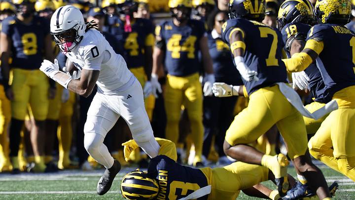 Penn State Nittany Lions wide receiver Chase Sowell (0) runs the ball defended by Michigan Wolverines cornerback Smith Snowden (3) Penn State Nittany Lions wide receiver Chase Sowell (0) runs the ball defended by Michigan Wolverines cornerback Smith Snowden (3)