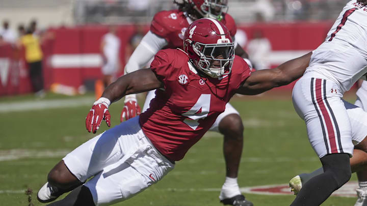 Oct 12, 2024; Tuscaloosa, Alabama, USA; Alabama Crimson Tide linebacker Qua Russaw (4) tries to bring down South Carolina Gamecocks quarterback Robby Ashford (1) at Bryant-Denny Stadium. Mandatory Credit: Gary Cosby Jr.-Imagn Images Oct 12, 2024; Tuscaloosa, Alabama, USA; Alabama Crimson Tide linebacker Qua Russaw (4) tries to bring down South Carolina Gamecocks quarterback Robby Ashford (1) at Bryant-Denny Stadium. Mandatory Credit: Gary Cosby Jr.-Imagn Images