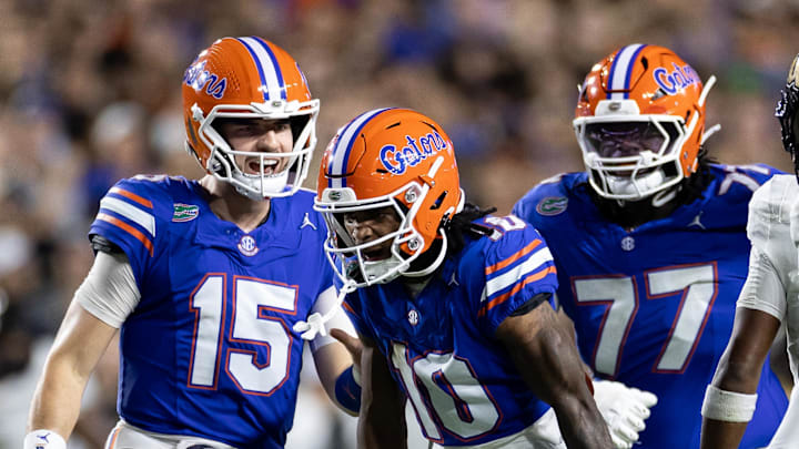 Oct 5, 2024; Gainesville, Florida, USA; Florida Gators quarterback Graham Mertz (15) and wide receiver Tank Hawkins (10) celebrate a first down pass against the UCF Knights during the first half at Ben Hill Griffin Stadium. Mandatory Credit: Matt Pendleton-Imagn Images