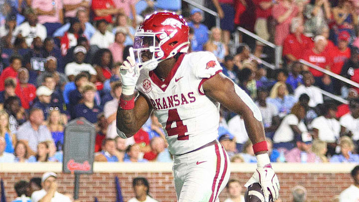 Sep 13, 2025; Oxford, Mississippi, USA; Arkansas Razorbacks running back Mike Washington Jr. (4) reacts after a touchdown during the fourth quarter at Vaught-Hemingway Stadium. Sep 13, 2025; Oxford, Mississippi, USA; Arkansas Razorbacks running back Mike Washington Jr. (4) reacts after a touchdown during the fourth quarter at Vaught-Hemingway Stadium.