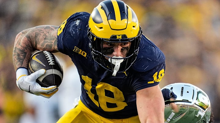Michigan tight end Colston Loveland (18) makes a catch against Oregon defensive back Kobe Savage (5) during the second half at Michigan Stadium in Ann Arbor on Saturday, Nov. 2, 2024. Michigan tight end Colston Loveland (18) makes a catch against Oregon defensive back Kobe Savage (5) during the second half at Michigan Stadium in Ann Arbor on Saturday, Nov. 2, 2024.