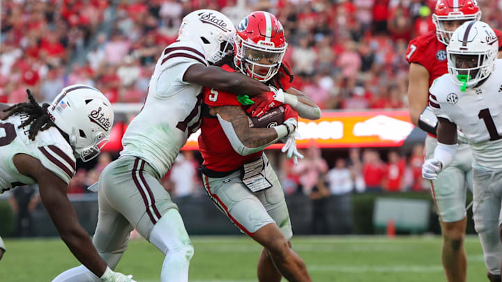  Georgia Bulldogs wide receiver Anthony Evans III (5) runs after a catch against the Mississippi State Bulldogs in the third quarter at Sanford Stadium.