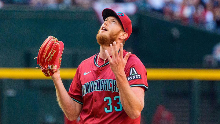 Mar 30, 2025; Phoenix, Arizona, USA; Arizona Diamondbacks pitcher A.J. Puk (33) reacts after getting the final out of the game to beat the Chicago Cubs at Chase Field. Mandatory Credit: Allan Henry-Imagn Images Mar 30, 2025; Phoenix, Arizona, USA; Arizona Diamondbacks pitcher A.J. Puk (33) reacts after getting the final out of the game to beat the Chicago Cubs at Chase Field. Mandatory Credit: Allan Henry-Imagn Images