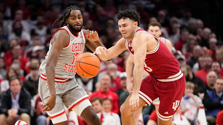Ohio State guard Evan Mahaffey (12) chases after Indiana guard Anthony Leal (3) during a February game in Columbus.