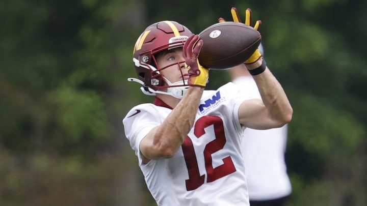 Jun 5, 2024; Ashburn, VA, USA; Washington Commanders wide receiver Luke McCaffrey (12) catches a pass during an OTA workout at Commanders Park. Mandatory Credit: Geoff Burke-USA TODAY Sports Jun 5, 2024; Ashburn, VA, USA; Washington Commanders wide receiver Luke McCaffrey (12) catches a pass during an OTA workout at Commanders Park. Mandatory Credit: Geoff Burke-USA TODAY Sports