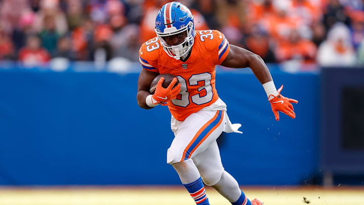 Jan 5, 2025; Denver, Colorado, USA; Denver Broncos running back Javonte Williams (33) runs the ball in the second quarter against the Kansas City Chiefs at Empower Field at Mile High. Jan 5, 2025; Denver, Colorado, USA; Denver Broncos running back Javonte Williams (33) runs the ball in the second quarter against the Kansas City Chiefs at Empower Field at Mile High.
