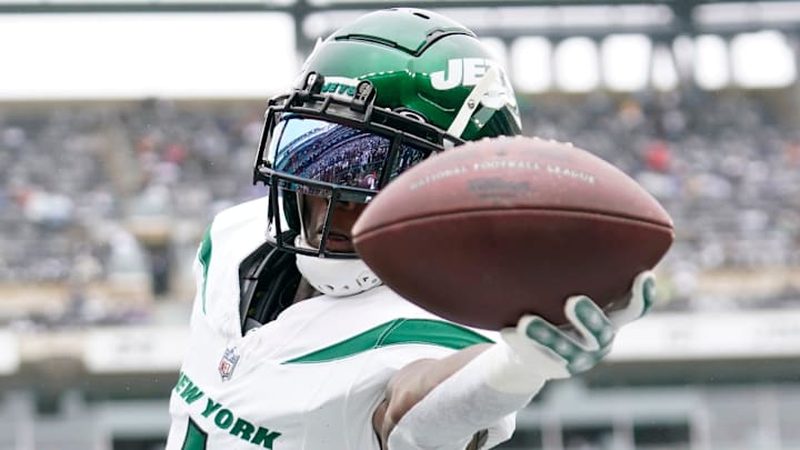 New York Jets cornerback Sauce Gardner (1) catches the ball during warmups before a game against the New England Patriots.