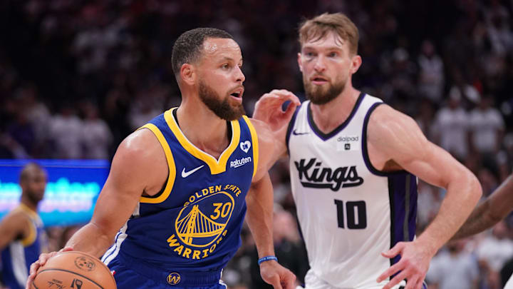 Apr 16, 2024; Sacramento, California, USA; Golden State Warriors guard Stephen Curry (30) dribbles the ball in front of Sacramento Kings forward Domantas Sabonis (10) in the fourth quarter during a play-in game of the 2024 NBA playoffs at the Golden 1 Center.