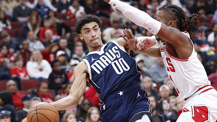 Jan 10, 2026; Chicago, Illinois, USA; Dallas Mavericks guard Max Christie (00) drives to the basket against Chicago Bulls guard Ayo Dosunmu (11) during the second half at United Center. Mandatory Credit: Kamil Krzaczynski-Imagn Images