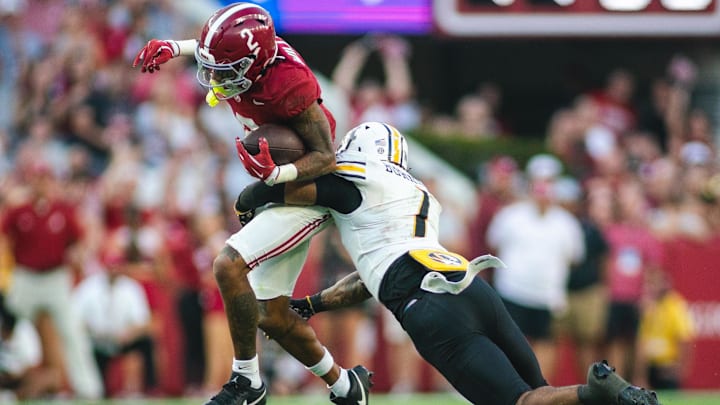 Oct 26, 2024; Tuscaloosa, Alabama, USA; Missouri Tigers safety Marvin Burks Jr. (1) brings down Alabama Crimson Tide wide receiver Ryan Williams (2) during the fourth quarter at Bryant-Denny Stadium. Mandatory Credit: Will McLelland-Imagn Images