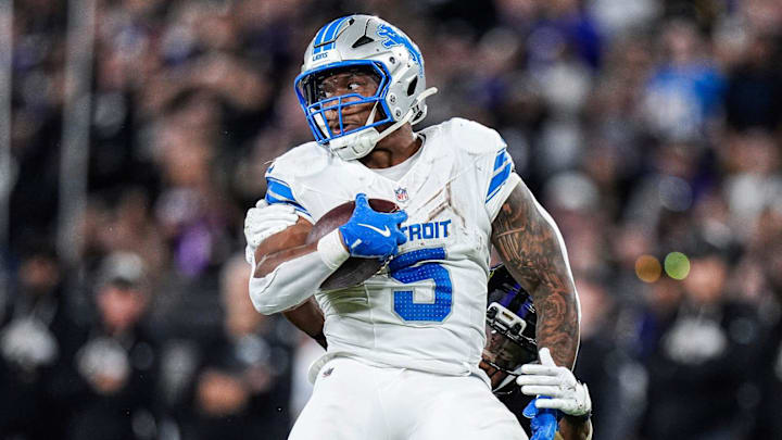 Detroit Lions running back David Montgomery (5) runs against Baltimore Ravens cornerback Marlon Humphrey (44) and defensive tackle Broderick Washington (96) during the second half at M&T Bank Stadium in Baltimore, Md. on Monday, Sept. 22, 2025. Detroit Lions running back David Montgomery (5) runs against Baltimore Ravens cornerback Marlon Humphrey (44) and defensive tackle Broderick Washington (96) during the second half at M&T Bank Stadium in Baltimore, Md. on Monday, Sept. 22, 2025.