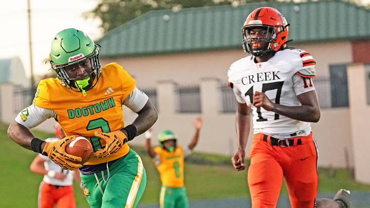 DeLand’s Taihj Moore (2) catches the ball and scores a touchdown against Spruce Creek on Sept. 25, 2026, at Spec Martin Stadium.  Last week, he rushed six times for 151 yards and two TDs and caught one pass for 48 yards to power the Bulldogs past University High (Orange City), 57-7.