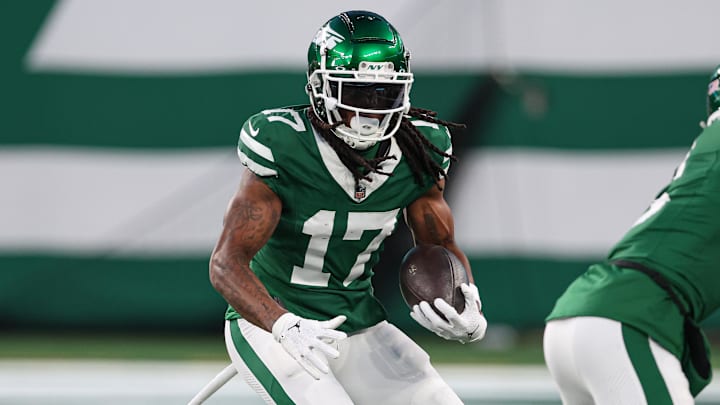 Jan 5, 2025; East Rutherford, New Jersey, USA; New York Jets wide receiver Davante Adams (17) gains yards after catch during the first quarter against the Miami Dolphins at MetLife Stadium. Mandatory Credit: Vincent Carchietta-Imagn Images