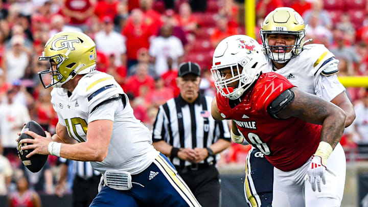 Louisville defensive tackle Rene Konga (90) pressures Georgia Tech quarterback Haynes King (10)