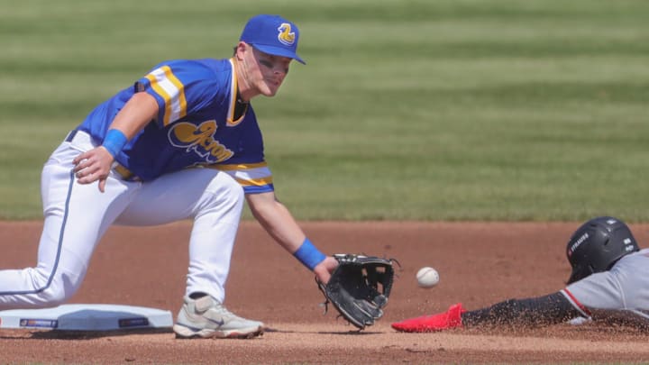 RubberDucks second baseman Travis Bazzana catches a throw from the catcher as Altoona Curve’s Termarr Johnson slides into second on a stolen base attempt on April 13, 2025, in Akron, Ohio. RubberDucks second baseman Travis Bazzana catches a throw from the catcher as Altoona Curve’s Termarr Johnson slides into second on a stolen base attempt on April 13, 2025, in Akron, Ohio.