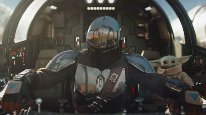 (L-R) Mandalorian (Pedro Pascal) and Grogu in Lucasfilm's THE MANDALORIAN & GROGU. Photo courtesy of Lucasfilm. © 2025 Lucasfilm Ltd™. All Rights Reserved.