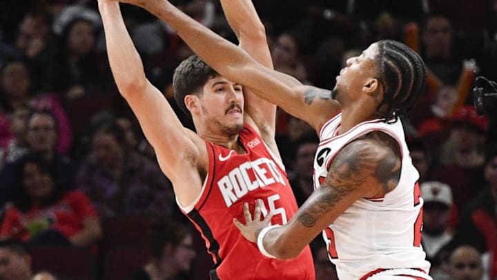 Nov 17, 2024; Chicago, Illinois, USA;  Chicago Bulls forward Dalen Terry (25) defends against Houston Rockets guard Reed Sheppard (15) during the second half at United Center. Mandatory Credit: Matt Marton-Imagn Images