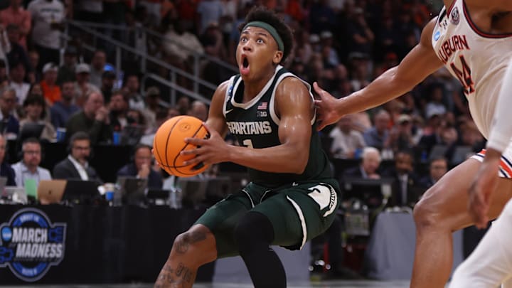 Mar 30, 2025; Atlanta, GA, USA; Michigan State Spartans guard Jeremy Fears Jr. (1) drives against Auburn Tigers center Dylan Cardwell (44) during the second half in the South Regional final of the 2025 NCAA tournament at State Farm Arena. Mandatory Credit: Brett Davis-Imagn Images Mar 30, 2025; Atlanta, GA, USA; Michigan State Spartans guard Jeremy Fears Jr. (1) drives against Auburn Tigers center Dylan Cardwell (44) during the second half in the South Regional final of the 2025 NCAA tournament at State Farm Arena. Mandatory Credit: Brett Davis-Imagn Images