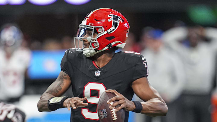 Dec 22, 2024; Atlanta, Georgia, USA; Atlanta Falcons quarterback Michael Penix Jr. (9) looks for a receiver against the New York Giants during the second half at Mercedes-Benz Stadium. Mandatory Credit: Dale Zanine-Imagn Images