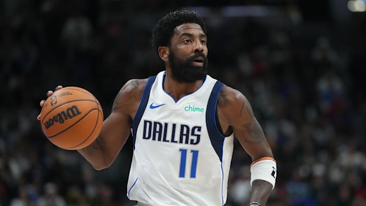 Nov 10, 2024; Denver, Colorado, USA;  Dallas Mavericks guard Kyrie Irving (11) controls the ball in the second half against the Denver Nuggets at Ball Arena. Mandatory Credit: Ron Chenoy-Imagn Images