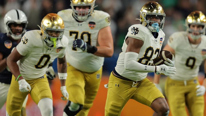 Jan 9, 2025; Miami, FL, USA; Notre Dame Fighting Irish wide receiver Jayden Thomas (83) runs the ball in the second half against the Penn State Nittany Lions in the Orange Bowl at Hard Rock Stadium. Jan 9, 2025; Miami, FL, USA; Notre Dame Fighting Irish wide receiver Jayden Thomas (83) runs the ball in the second half against the Penn State Nittany Lions in the Orange Bowl at Hard Rock Stadium.