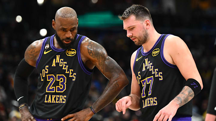 Los Angeles Lakers forward/guard Luka Doncic (77) talks with Los Angeles Lakers forward LeBron James (23)